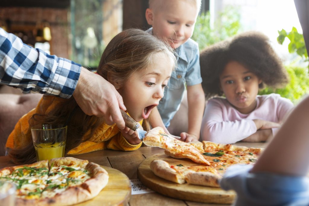 close up kids with delicious pizza
